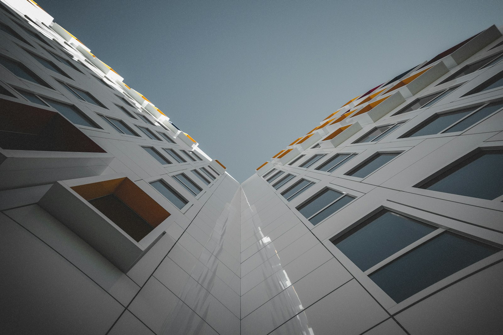Modern architectural building viewed from below, representing Efie Asem's design vision